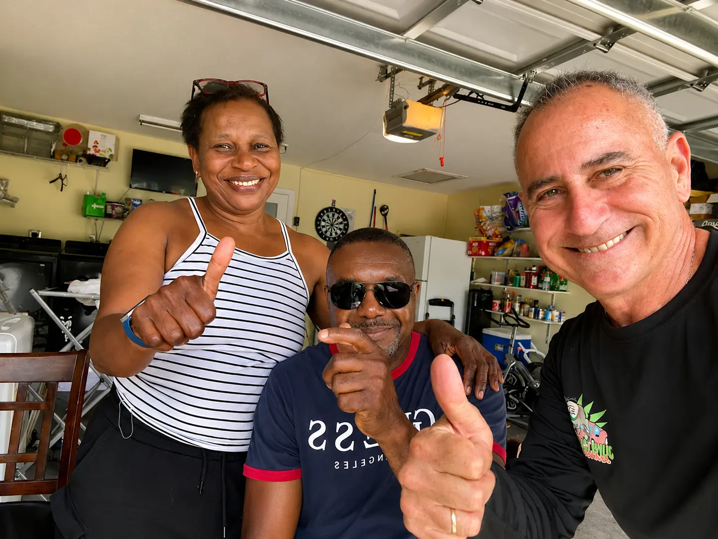 Customers giving a thumbs up after securing a deal with Junk Car Dog buyers and removing an old car on lawn curb appeal issues.