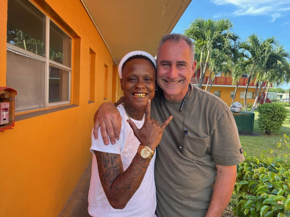 Two people promoting Cash for Junk Car Hialeah