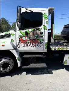 Junk car buyers in Coral Springs, FL using a tow truck to pick up an old vehicle.