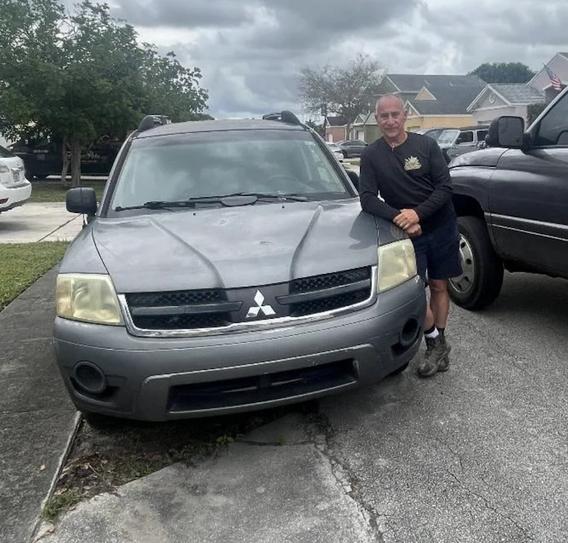 Junk Car Dog picking up a 2006 Mitsubishi Endeavor from a customer in Miramar, FL.